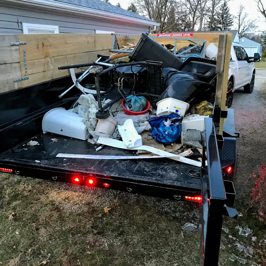 Roll-off dumpster delivered to a residential driveway in Le Sueur