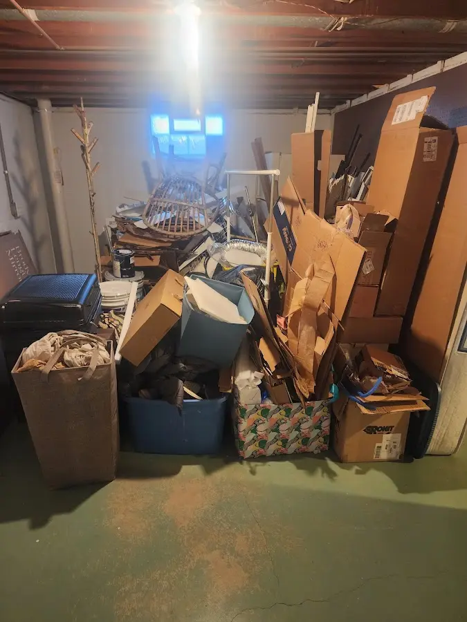 Roll-off dumpster container at job site for 2 Yard Dumpster Rental in Le Sueur